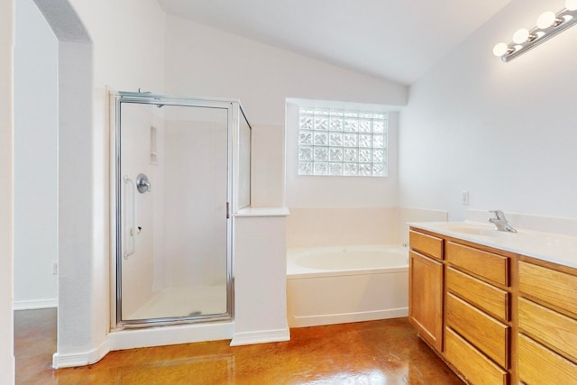 bathroom featuring vanity, separate shower and tub, and lofted ceiling