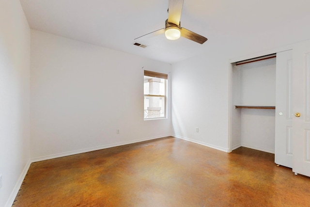 unfurnished bedroom featuring ceiling fan, a closet, and concrete floors