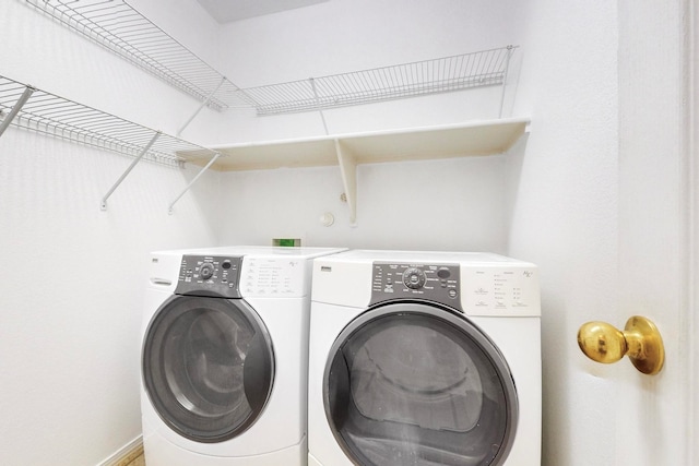 clothes washing area featuring washing machine and dryer