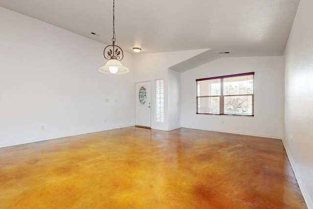 spare room featuring lofted ceiling