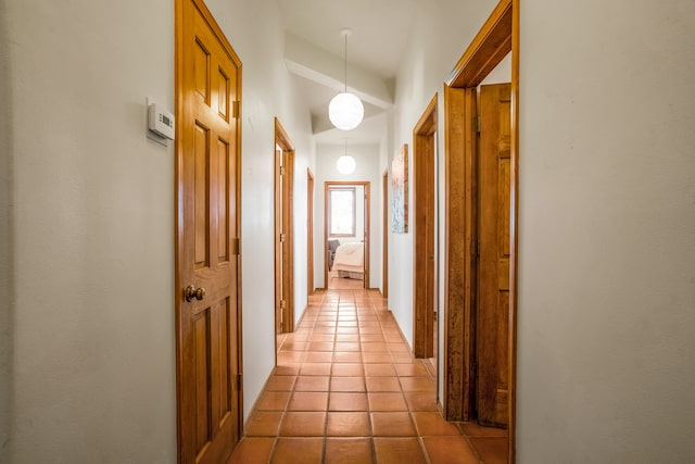 hall featuring light tile patterned flooring