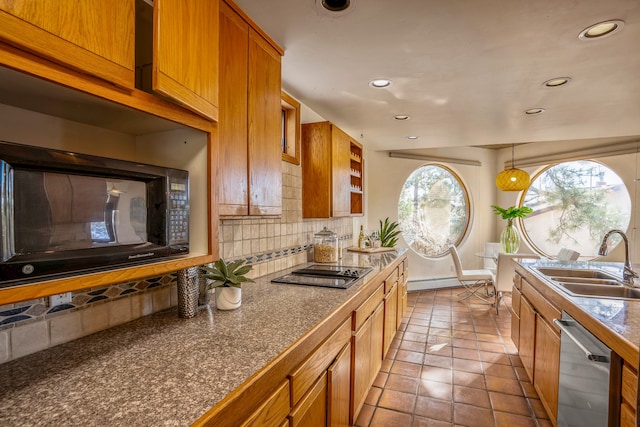 kitchen with sink, tile patterned flooring, pendant lighting, decorative backsplash, and black appliances