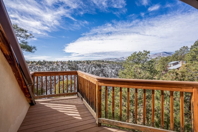 wooden deck with a mountain view