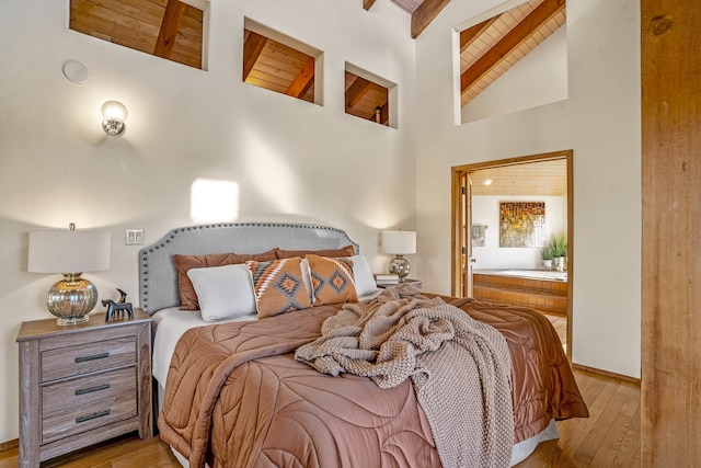 bedroom featuring wooden ceiling, beamed ceiling, high vaulted ceiling, and light hardwood / wood-style floors