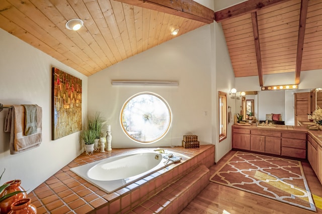 bathroom with wood-type flooring, lofted ceiling with beams, and wooden ceiling