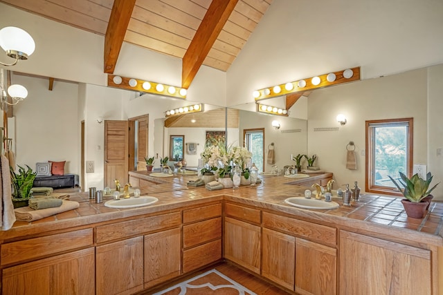 bathroom featuring hardwood / wood-style floors, vaulted ceiling with beams, wooden ceiling, and vanity