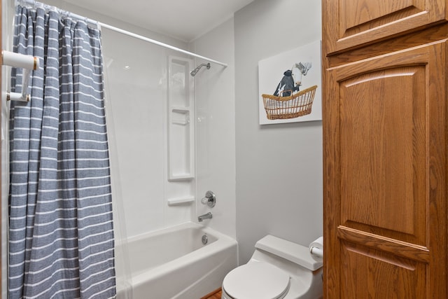 bathroom featuring shower / bath combo and toilet