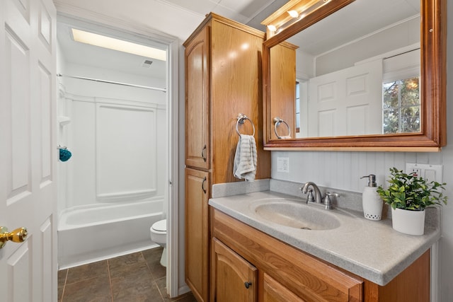 full bathroom with vanity, toilet, ornamental molding, and tub / shower combination