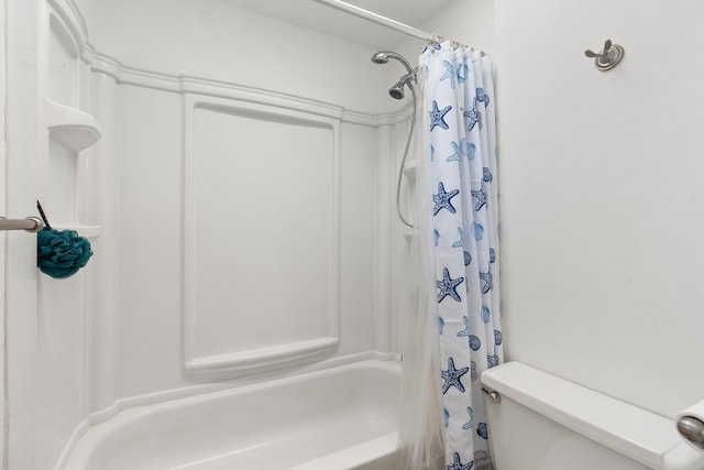 bathroom featuring toilet and shower / bath combo with shower curtain