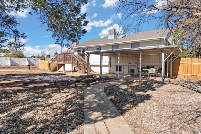 rear view of house with a deck and central air condition unit