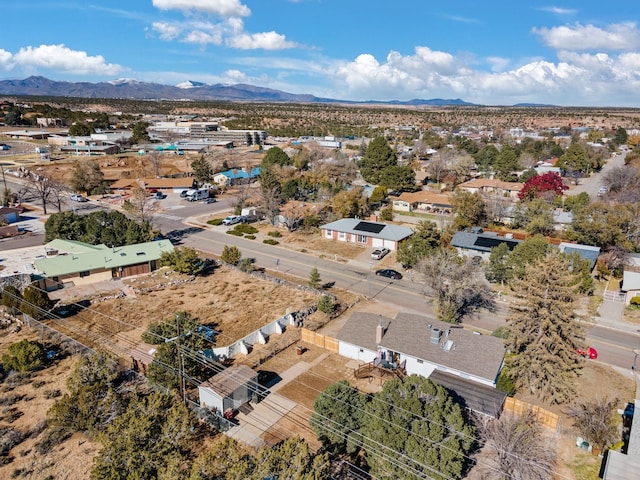 birds eye view of property with a mountain view