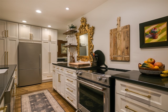 kitchen featuring white cabinetry, dark wood-type flooring, and stainless steel appliances