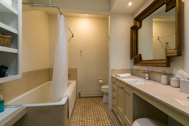 bathroom featuring vanity, toilet, and baseboard heating