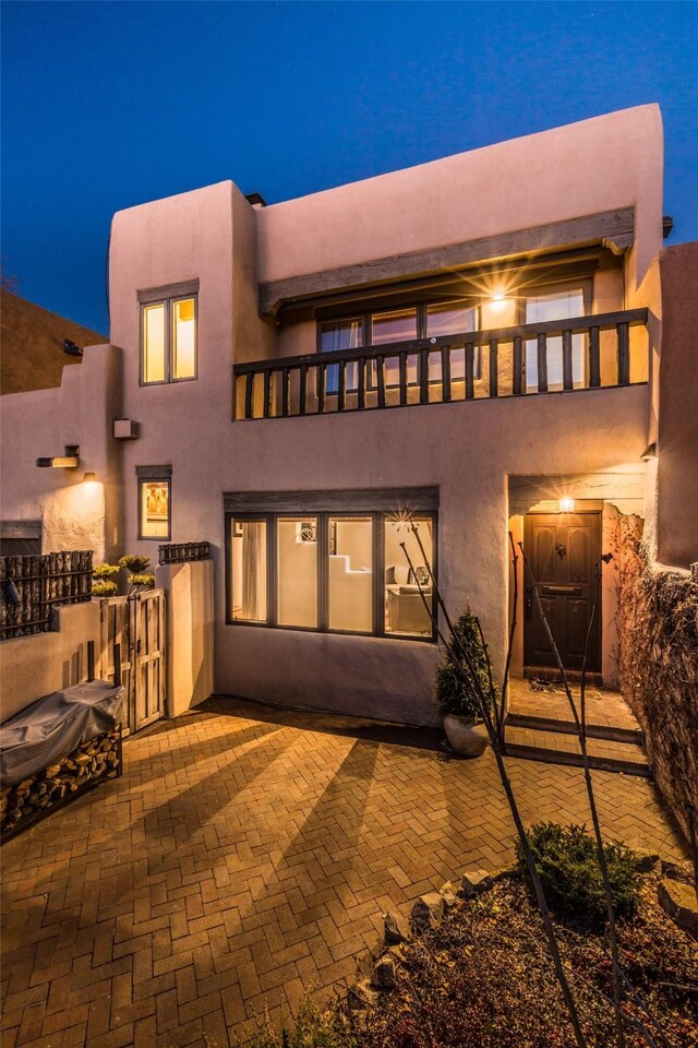 patio terrace at dusk featuring outdoor lounge area