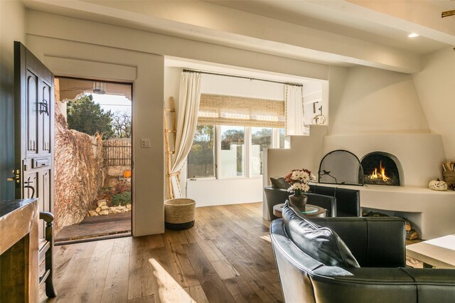 entryway with a fireplace and wood-type flooring