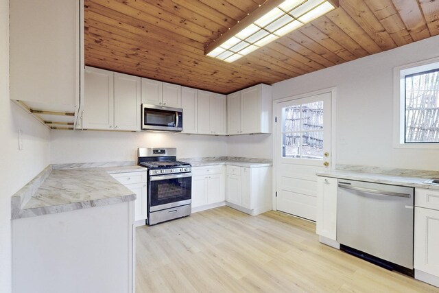 unfurnished room featuring light wood-type flooring