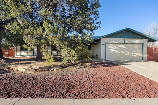 single story home with a garage