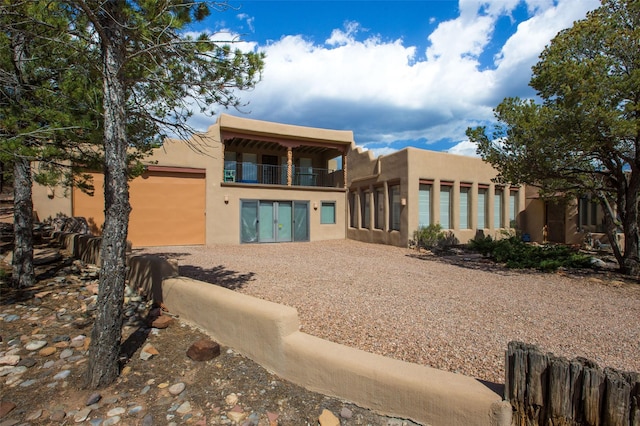 rear view of house with a balcony