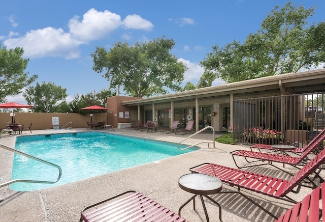 view of swimming pool featuring a patio