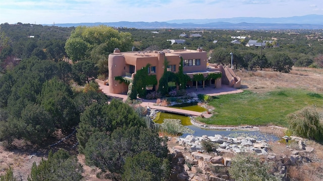 birds eye view of property with a mountain view