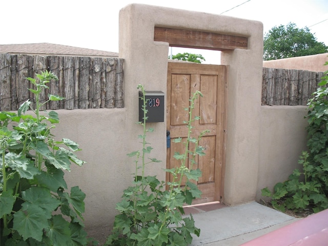 819 Fayette, Santa Fe, NM 87505 - doorway to property with stucco siding
