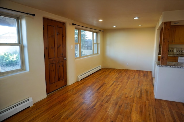 819 Fayette, Santa Fe, NM 87505 - foyer with a baseboard radiator, wood finished floors, and recessed lighting