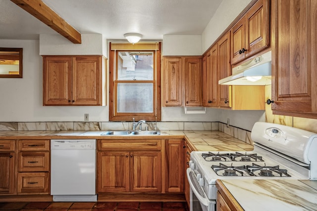 kitchen featuring beam ceiling, sink, a textured ceiling, and white appliances