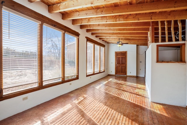 unfurnished sunroom with beamed ceiling and ceiling fan