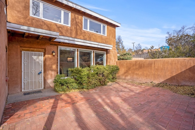 rear view of property featuring a patio