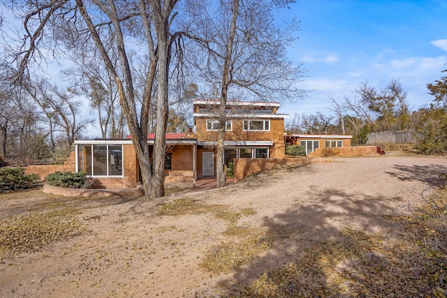 view of front of house with a sunroom