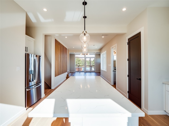 corridor featuring light hardwood / wood-style flooring