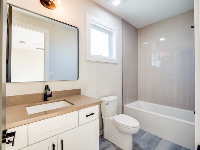 full bathroom featuring tile patterned floors, vanity, toilet, and tiled shower / bath