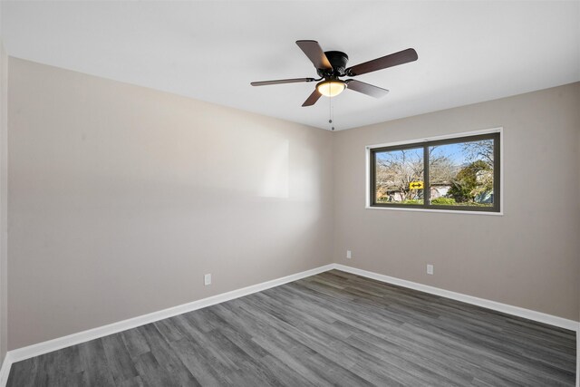 unfurnished room featuring dark hardwood / wood-style flooring and ceiling fan