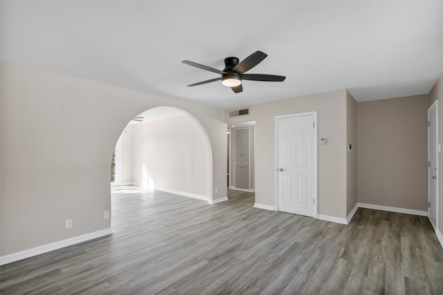 spare room with ceiling fan and light wood-type flooring