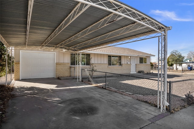 exterior space with a garage and a carport