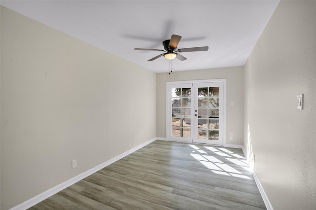 unfurnished room featuring wood-type flooring, french doors, and ceiling fan