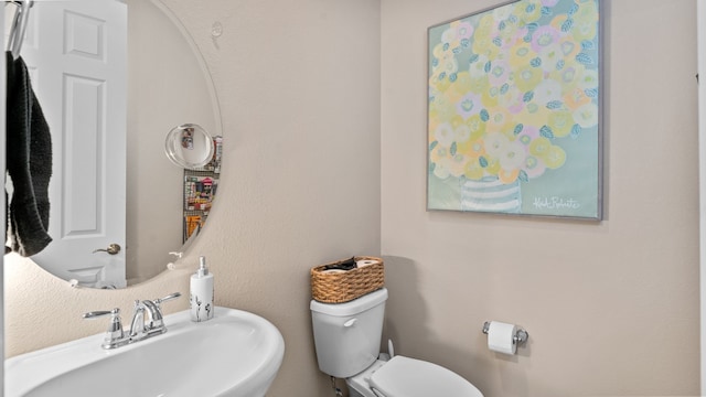 bathroom featuring a sink and toilet