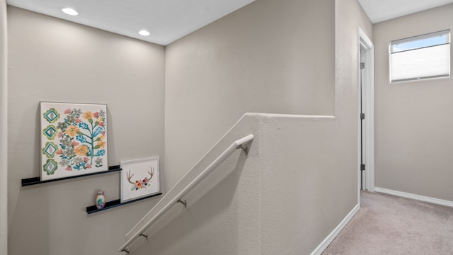 staircase featuring recessed lighting, baseboards, and carpet