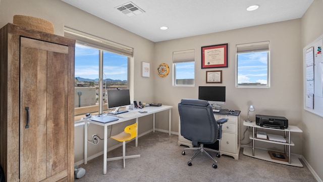 carpeted office space with recessed lighting, visible vents, baseboards, and a healthy amount of sunlight