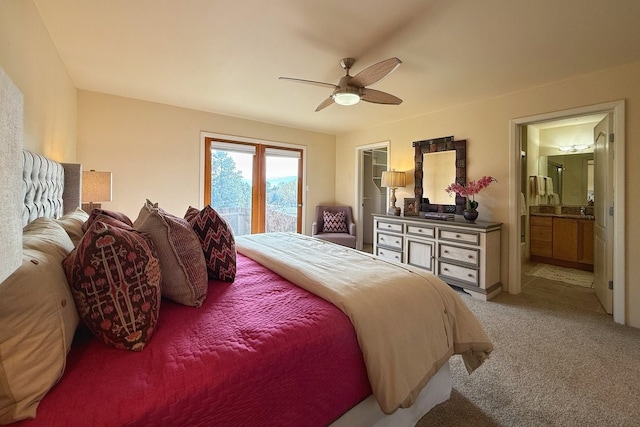 carpeted bedroom featuring access to outside, connected bathroom, and ceiling fan