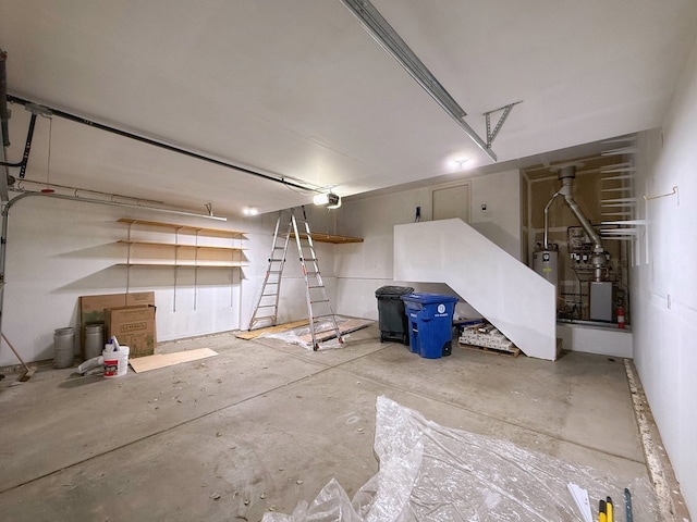 garage with a garage door opener and water heater