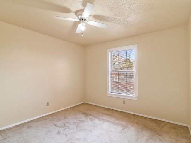2501 Zia Rd Unit 10-210, Santa Fe, NM 87505 - empty room with baseboards, a ceiling fan, carpet flooring, and a textured ceiling