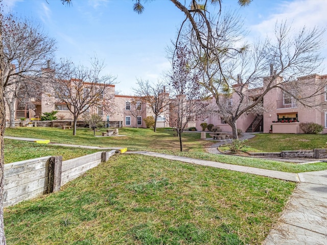 surrounding community featuring a lawn