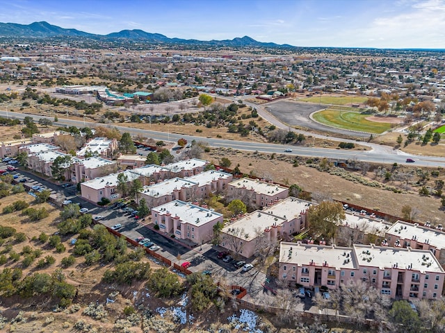 birds eye view of property with a mountain view