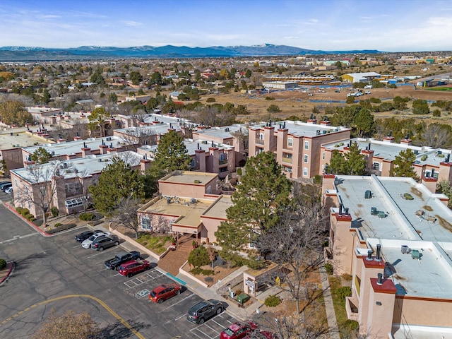 birds eye view of property featuring a mountain view