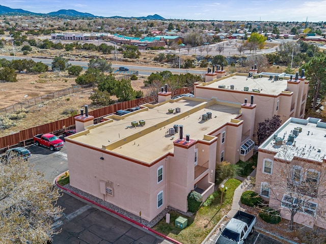 birds eye view of property with a mountain view