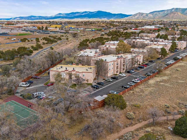 birds eye view of property with a mountain view