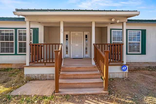 doorway to property featuring a porch