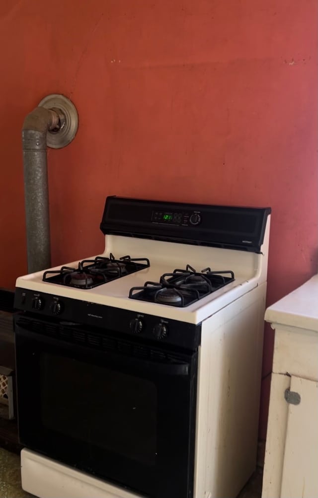 kitchen with white range with gas cooktop