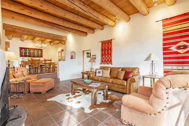 tiled living room with beam ceiling, an inviting chandelier, wooden ceiling, and a wood stove